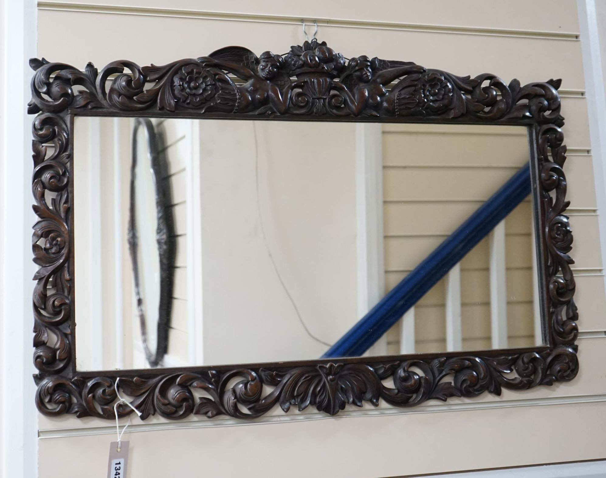 An 18th century style carved walnut rectangular wall mirror, width 84cm, height 56cm